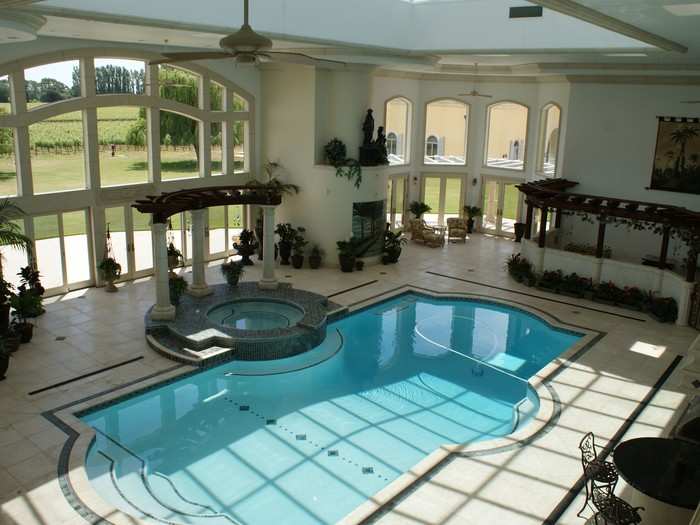 And the home has an indoor pool. The room has four skylights with 34-foot windows looking out to the lawn.