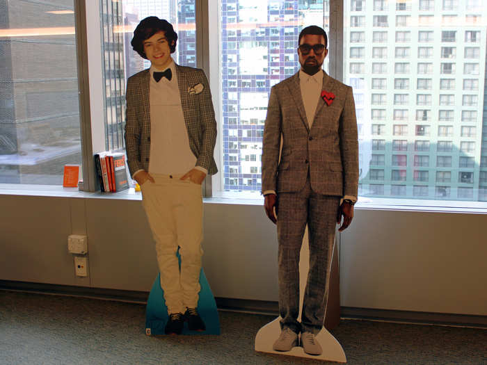 Life-size cutouts of Harry Styles and Kanye West lend even more star power and fun to the office environment.