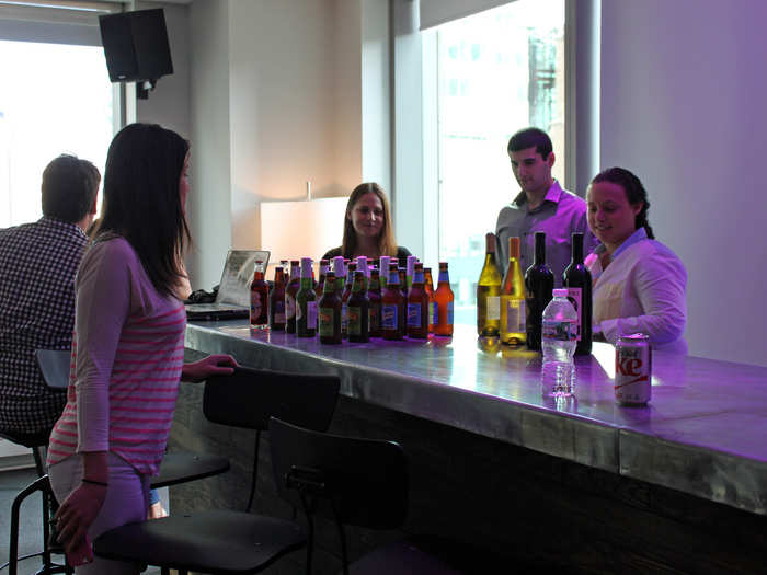 Matt was scheduled to perform for the office after his interview. Before the concert started, employees grabbed drinks from the bar.