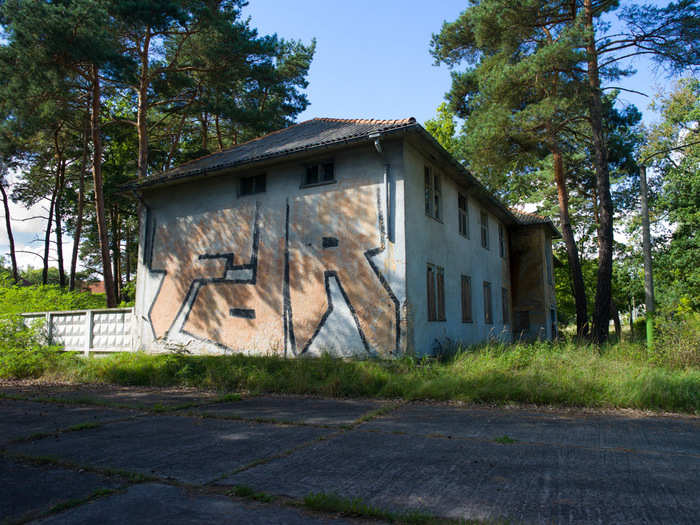 The site of the Olympic Village for the 1936 Berlin Games, where Jesse Owens won four gold medals under the watchful eye of Adolph Hitler, today stands abandoned and graffitied, except for Owens