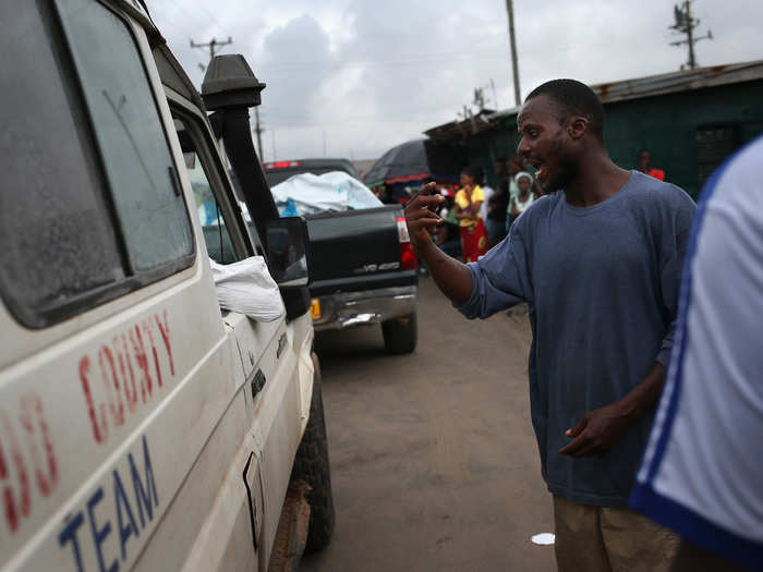 Large crowds have driven away burial teams in certain areas of Monrovia, shouting that "Ebola is a hoax."