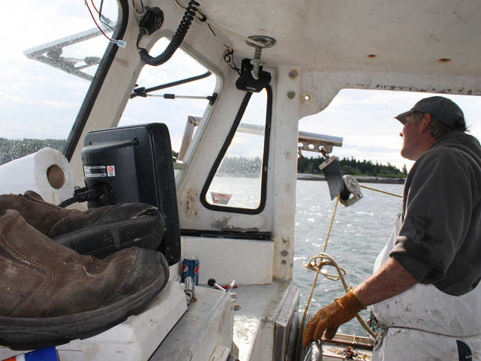 By 6 a.m., Craig is at the helm. He begins zigzagging in and out of buoys to locate his traps.