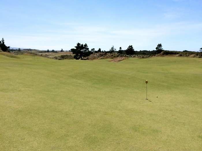 This is the putting green next to the first hole of Pacific Dunes, which is where I played my first round. In the distance is the Punch Bowl.