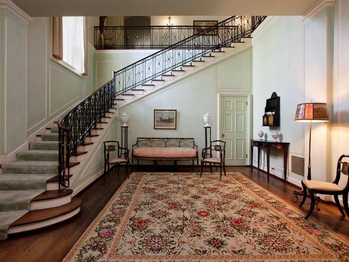 Up these mint stairs are the bedroom suites and even more sitting rooms.