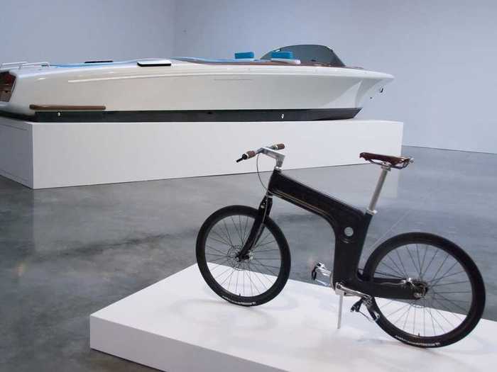 This carbon-fiber bicycle and the speedboat in the background come from an exhibit called "Marc Newson: Transport." Working with new materials is one way Apple could become a luxury brand.