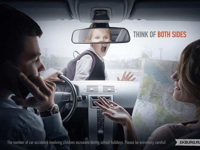 Ekburg.ru makes a comment on distracted driving. "Think of Both Sides." (Russia, 2013)