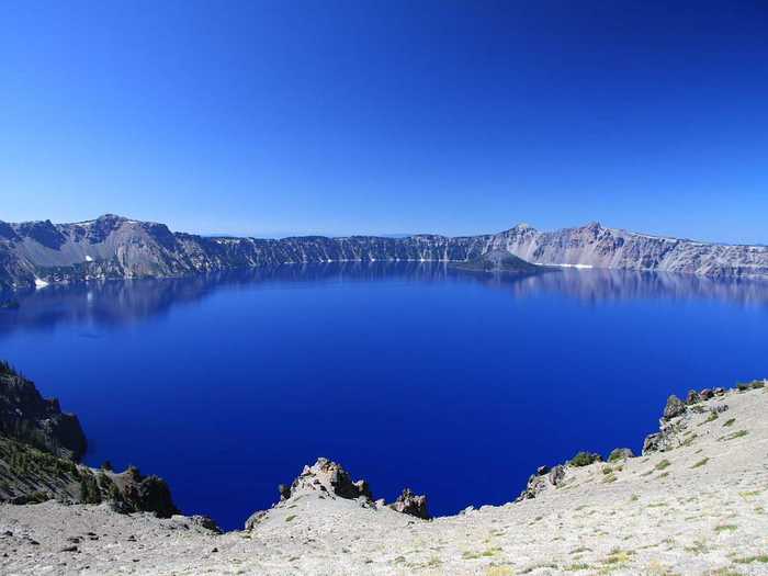 Crater Lake Caldera, in Oregon, was formed when a volcano named Mount Mazama erupted violently 7,700 years ago. The interaction between magma and water is likely to produce explosive eruptions in the future.
