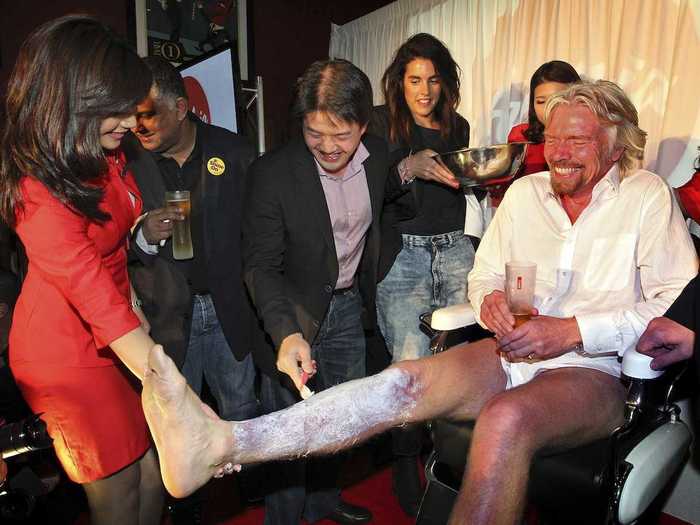 Here he is getting his legs shaved in preparation for his transformation into a stewardess.