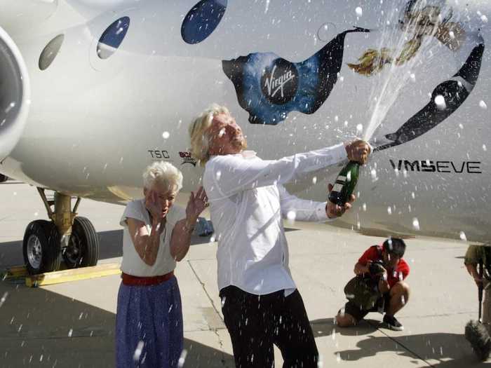 He christened Virgin Galactic ship WhiteKnightTwo with a spray of champagne alongside his mother Eve.