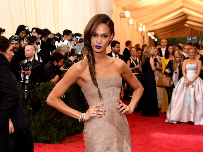 Model Joan Smalls looked elegant yet chic in her Vera Wang gown paired with purple lips and a fishtail braid at this year