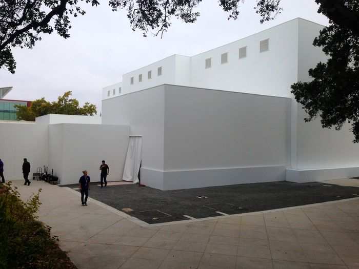 Security patrolled behind the Apple cube. What could it be for?