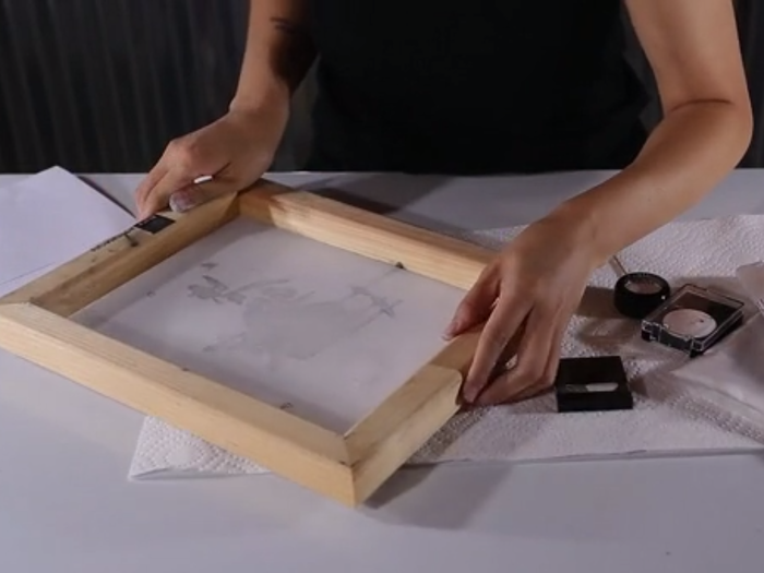 Using your fingers or a flat surface, press the powder into the pan. (For a professional finish, Choi recommends using a screen printing screen)