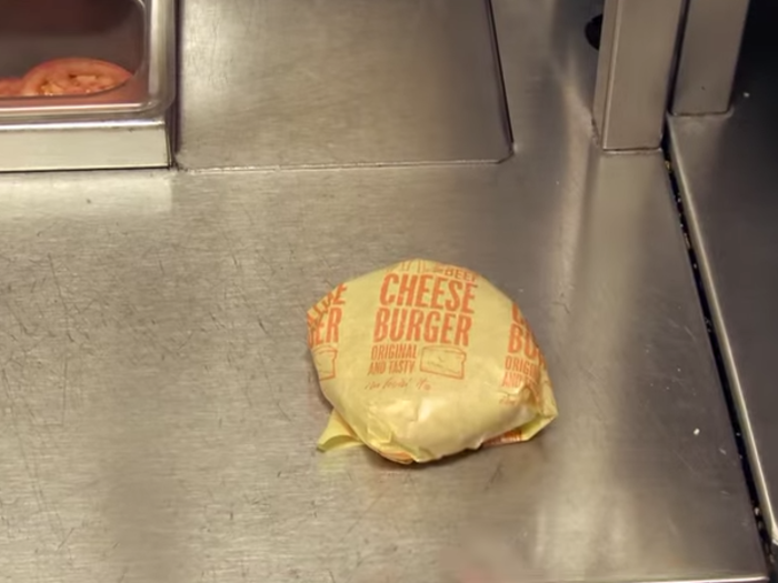 Finally, the burger is packaged and ready to be served.