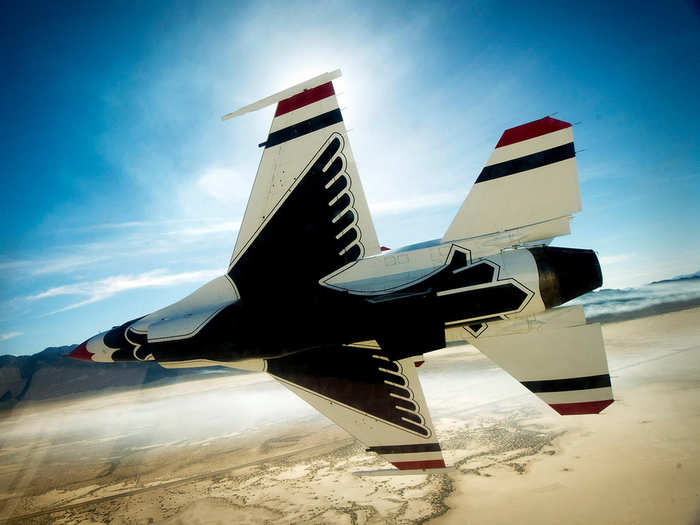 The Thunderbirds Diamond Formation performs a pass in review maneuver during a training sortie over a range in Nevada.