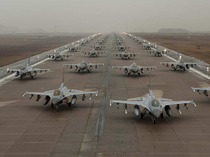 F-16 Fighting Falcons taxi down the flightline at Kunsan Air Base, South Korea.