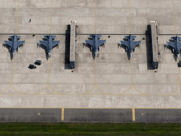 Maintenance personnel prepare F-16 Fighting Falcons for training flights at Kunsan Air Base, South Korea.