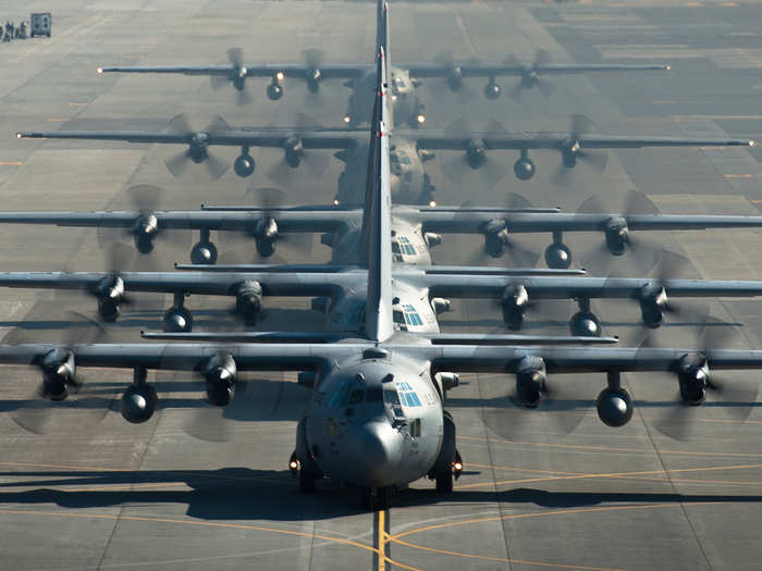 Six C-130 Hercules line up before flying a sortie during a readiness week at Yokota Air Base, Japan. The 374th Airlift Wing uses C-130s to support operations in the Pacific.