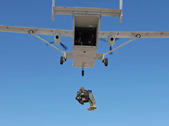 Tech. Sgt. Matthew Mensch exits a SC.7 Skyvan with a low profile parachute over the Edwards Farm drop zone, near Edwards Air Force Base, Calif. The parachute is intended to replace the BA-22 parachute, which is currently configured for use in the AC-130 Gunship.