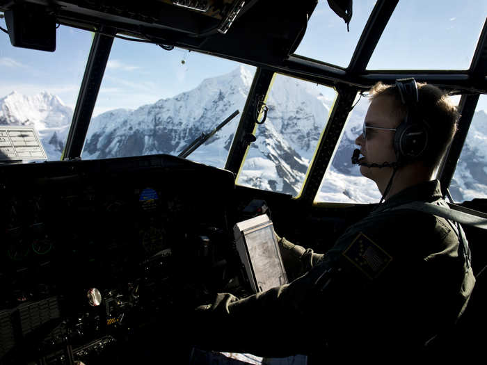 Capt. Steve Ludwig flies over miles of mountainous terrain in search for a crashed plane on the Yakutat Glacier in Alaska. Ludwig is an HC-130N King co-pilot with the 211th Rescue Squadron.