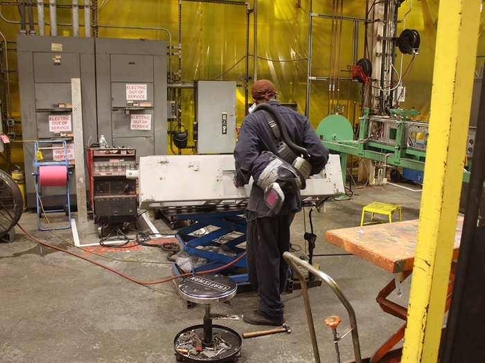 Around 400 people work at the factory, fabricating parts, assembling the cars, running system tests, and overhauling older cars. They also create tools that aid in the manufacturing.