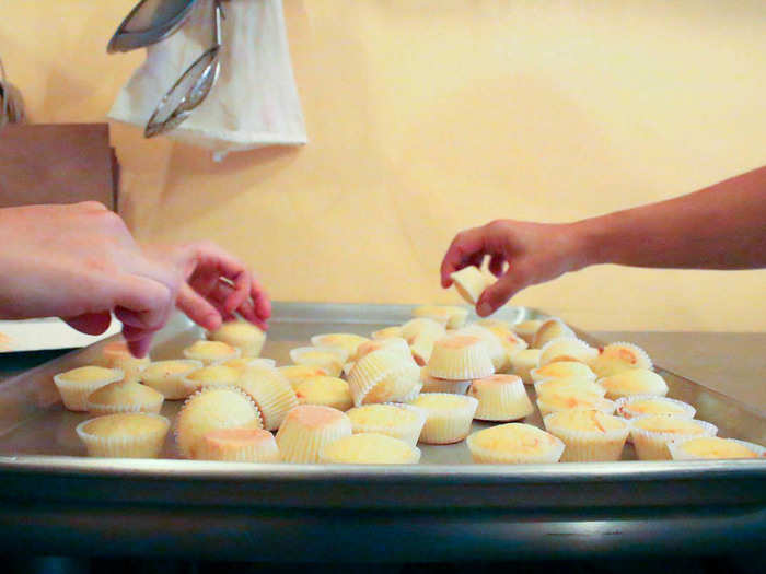 The cupcakes bake for just 10 minutes and are dumped onto a baking sheet for cooling. That