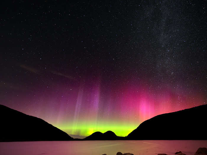 A stunning aurora reaches for the stars in Gray’s “Dancing Lights”. The rocky shoreline of Jordan Pond in Acadia National Park directs the eye straight to this spectacular spectacle of green, yellow, purple, and pink.