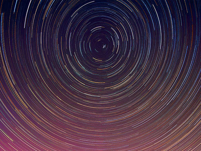 In “Spinning Aurora", Gray combines an image of one of Maine’s brilliant aurora light shows with an image of a star trail centered around the north star, Polaris. He shot both images along a coastline west of Baxter State Park and the result is a gorgeous compilation of color and the cosmos.