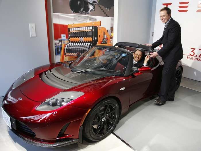 Look at the grin on the Toyota CEO