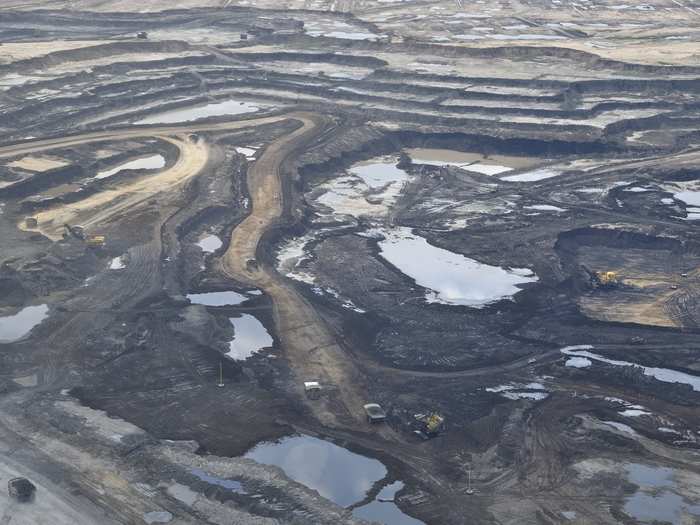 There are two main ways to extract oil from the Tar Sands. One way, known as "open-pit mining," extracts the bitumen oil which is closer to the surface of the Earth buy removing the soil above it.