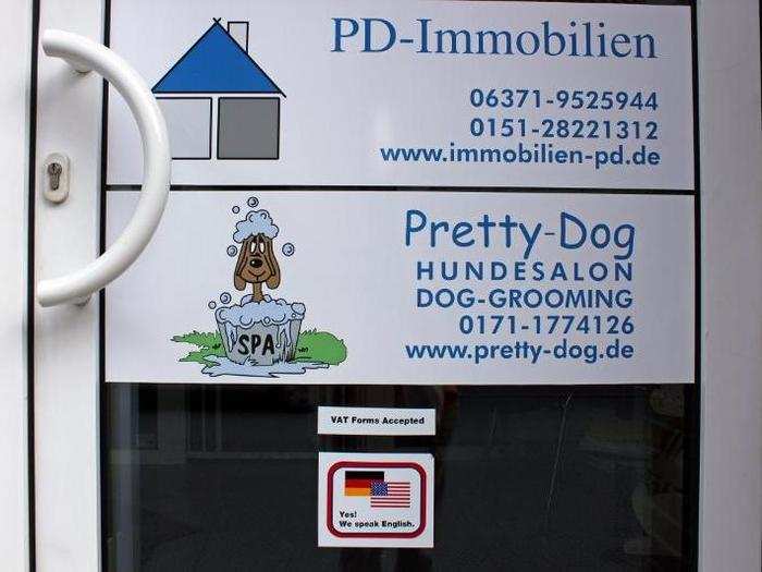 Businesses throughout the town also proudly display their ability to conduct work in both English and German.