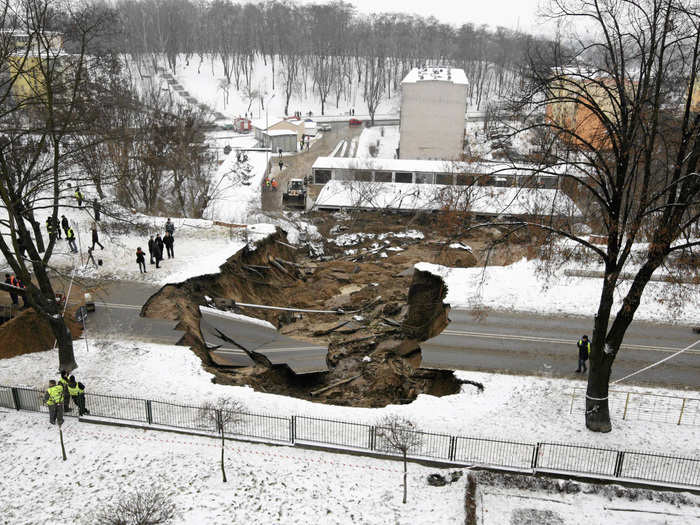 One night in December 2012, a sinkhole measuring 33 feet deep and 164 feet wide developed under this section of road in southern Poland.