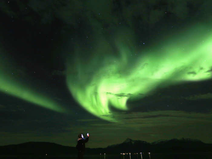 Auroras are caused by the collision of solar wind with the Earth