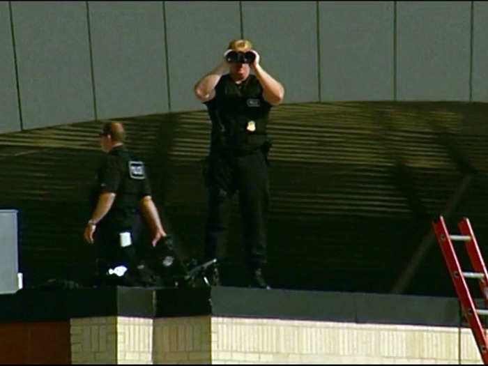 Before the president arrives, the Baton Rouge airport is shut down, and snipers take their positions.