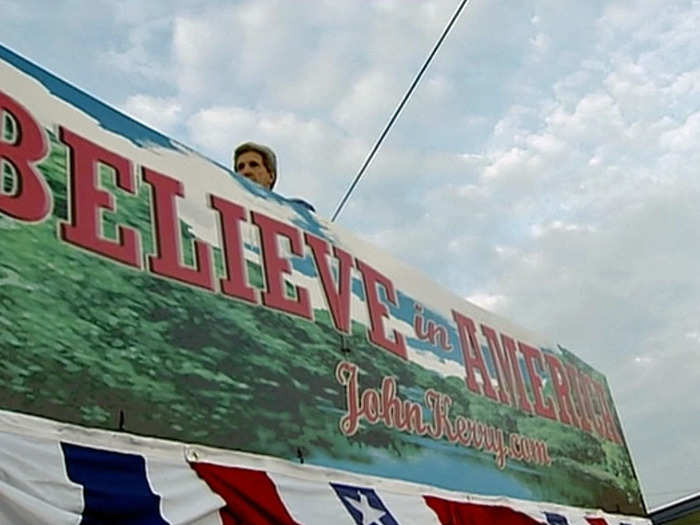 Candidates want to seem accessible, but the Service finds ways, like this armored banner, to discreetly guard them.