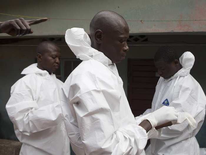 Citizens of the hardest-hit countries have been encouraged to contact authorities when someone dies from Ebola. Burial teams in protective suits, like this one, visit the homes of people suspected to have died of Ebola to collect the bodies.