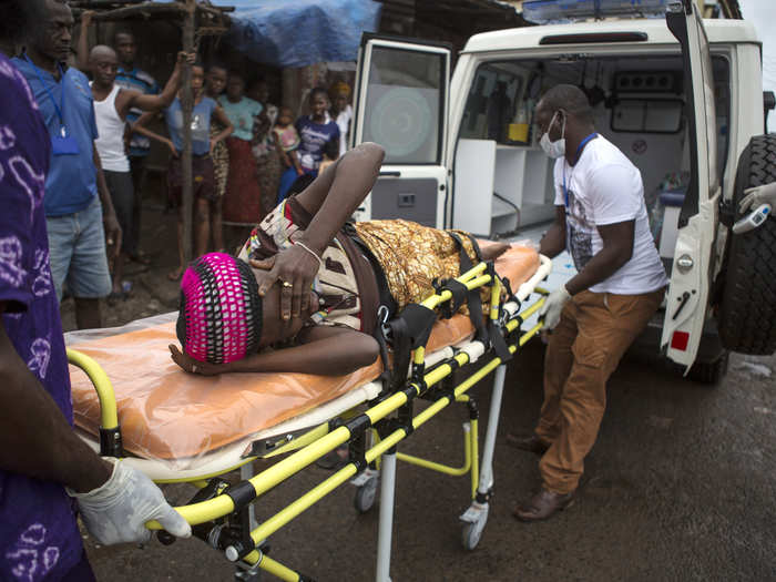 This pregnant woman, from Freetown, Sierra Leone, is also suspected of having Ebola. Here, health workers transfer her by stretcher into an ambulance. In the first known Ebola outbreak, in 1976, many victims were pregnant women.