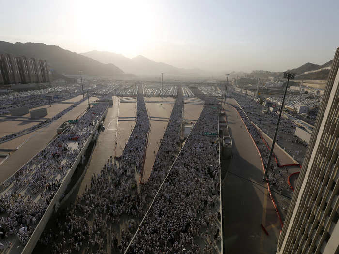 After visiting and praying at another location known as Muzdalifah, Muslims in Mecca travel again to the Mina to throw pebbles at large pillars to symbolically "stone the devil".