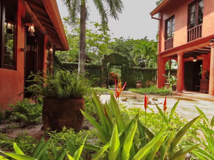 The Spanish influence radiates through the home, evident in the entrance courtyard.