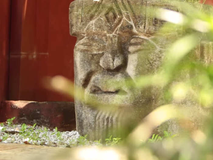 Traditional stone carvings dot the landscape.