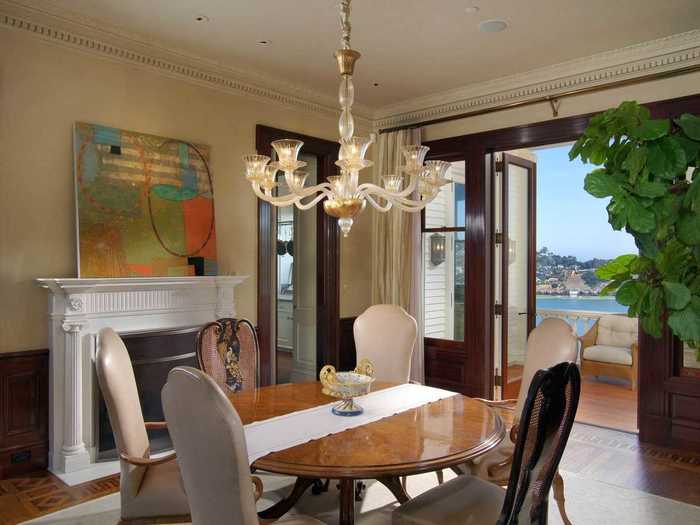 The dining room has mahogany wainscoting and hand-glaze walls, as do many other rooms in the home.