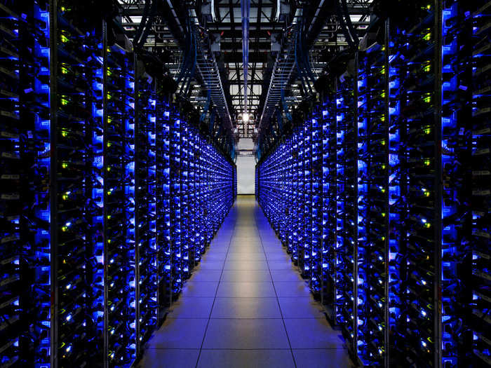 The blue LEDs on this row of servers let employees know that everything is running smoothly. Google has purchased 1000 megawatts of renewable energy to power these data centers now and into the future.