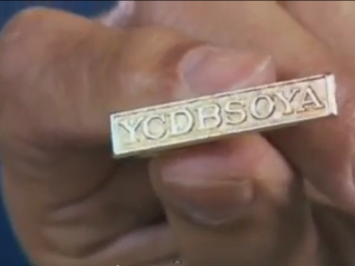 Cohen would give favored executives this tiepin, with a mysterious motto, "YCDBSOYA."