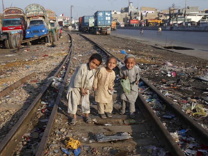 Sometimes useful things can be found amongst the rubbish. These children sift through garbage along the railway tracks for recyclable materials in Karachi, Pakistan.