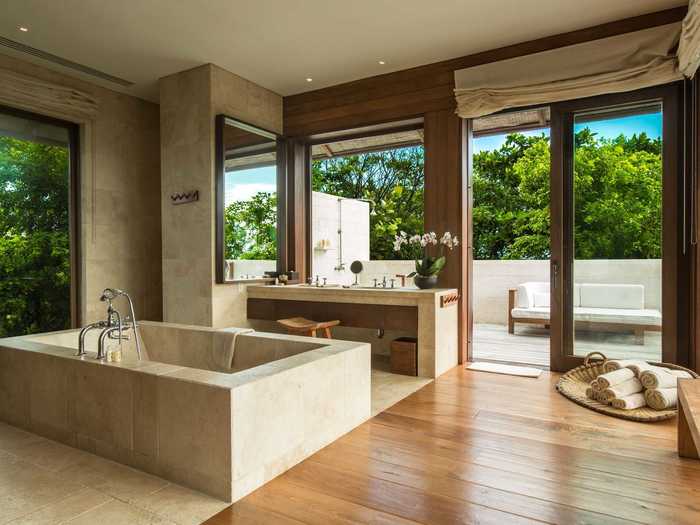 The travertine baths and outdoor showers are another gorgeous design element.