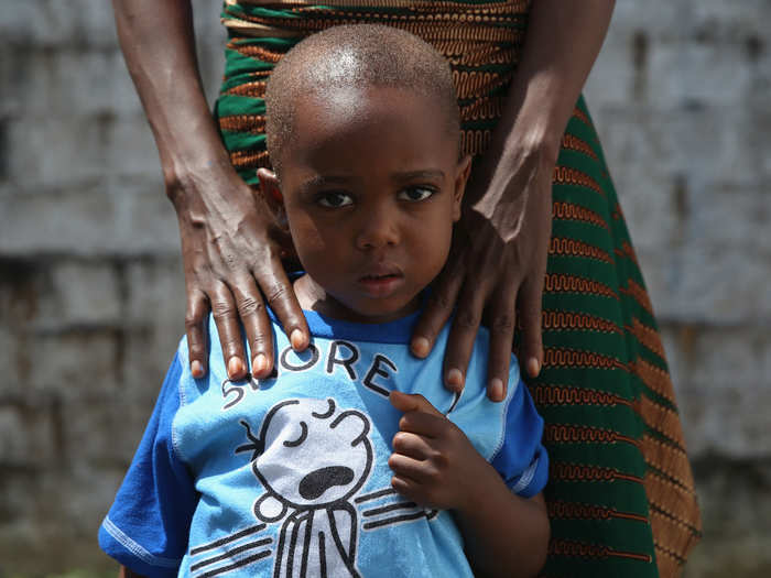 Both James Mulbah, 2, and his mother, Tamah Mulbah, 28, are preparing to leave a clinic in Liberia after surviving the virus.