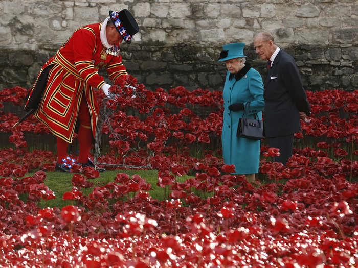 The Queen visits the poppies with husband Prince Philip.