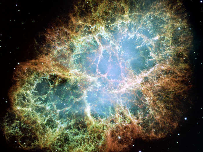 During the mid-90s, Hubble was in the middle of a race between to scientific teams using it to measure the distance to supernova explosions to determine the expansion rate of the universe. This is a Hubble image of the Crab Nebula — a beautiful look at what remains after a star explodes and goes supernova. In 1998, both teams announced that the expansion rate was accelerating. This discovery led to the 2012 Physics Nobel Prize.