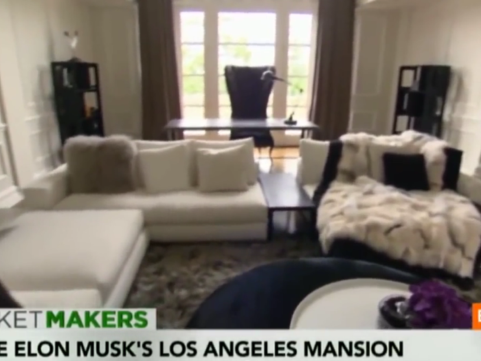 But the house still looked super posh when Bloomberg paid a visit in August 2013. Reporter Betty Liu notes the mink throw blanket on this couch.