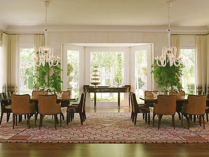 The dining room looks spacious and formal.