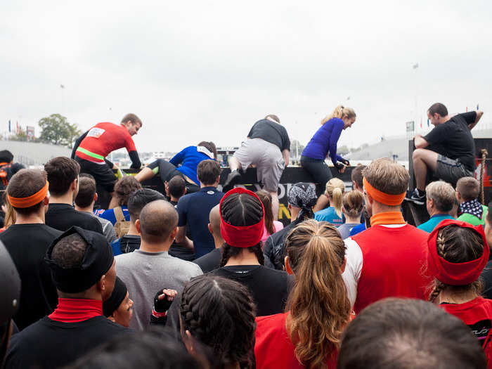 When participants are given the okay, Mudders have to climb a six-foot-high wooden wall to enter "the start chute."